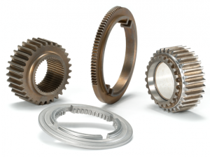The drive and driven sprockets, pressure plate and a sector gear are made for BorgWarner by Burgess-Norton Mfg. Co (Courtesy MPIF)